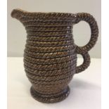 A vintage Govancroft coiled rope jug, 20cm tall.