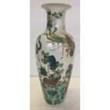 A large oriental vase with dragon and bird decoration.