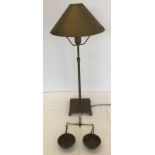 A brass extending table lamp with brass shade together with a small set of scales.