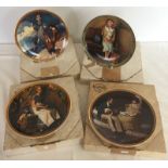 4 boxed Norman Rockwell ornamental plates with certificates.