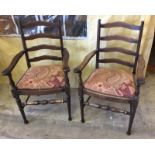 2 dark wood ladder back carver dining chairs.