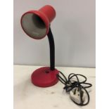 A c.1970's red plastic angle poise lamp.