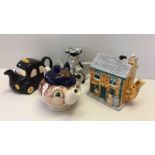 Four ornamental vintage teapots.
