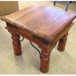 A wooden coffee table with metal banding.