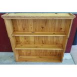 A pine dresser top, lately used as a bookcase