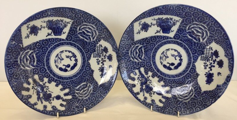2 oriental ceramic blue and white chargers with cherry blossom and floral design.