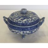 A blue and white 4 footed lidded dish, possibly a Japanese copy of a Chinese export piece.
