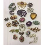 A small quantity of vintage stone set brooches.