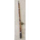A vintage split cane bamboo fishing rod.