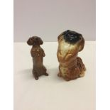 2 Beswick dog figurines in begging position.