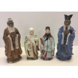 4 ceramic figurines of Chinese elders.