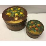 2 wooden round boxes with hand painted lids.