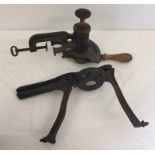 A vintage marmalade cutter together with a fruit press.