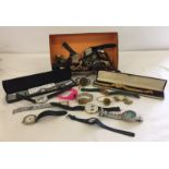 A box of assorted vintage and modern gents and ladies watches.