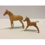 2 Beswick Palomino coloured ceramic foal figurines.