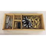 A box of mixed items, to included a small collection of penknives and brass toilet door signs.