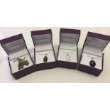 4 boxed costume jewellery necklaces.