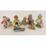 A collection of 7 boxed Cherished Teddies figures.
