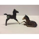 2 Beswick brown coloured foals in gloss finish.