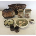 9 assorted pottery items.