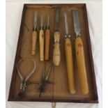 A quantity of vintage woodturning chisels. Together with a divider and a calliper.