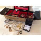 A c.1960's musical jewellery box containing jewellery.