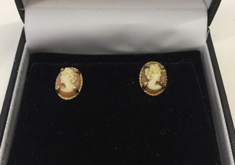 Pair of 9ct gold earrings set with cameos.