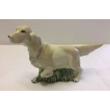 A large ceramic figurine of a setter dog, possibly USSR/Lomonosov.