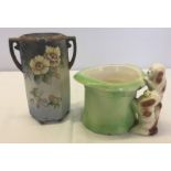 Twin handled Noritake vase with tube-lined floral design.