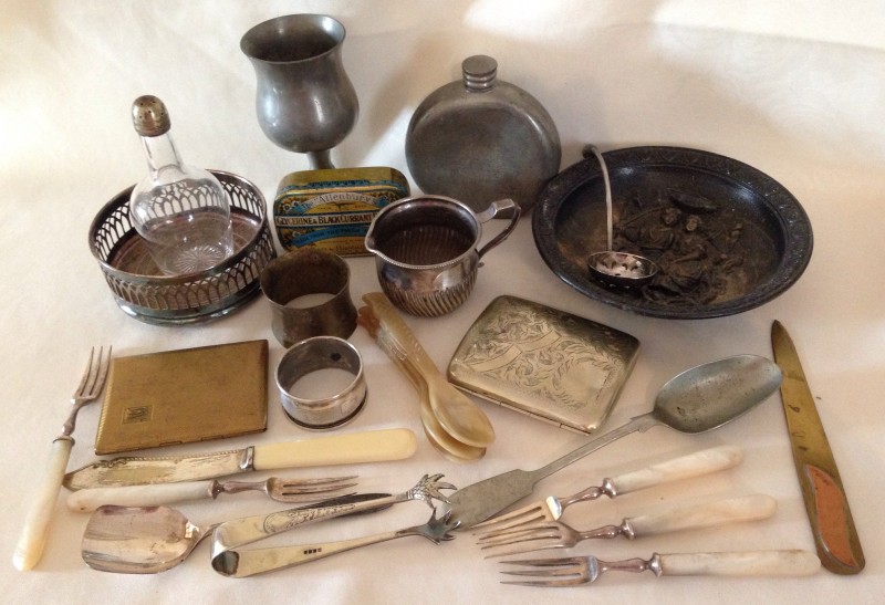 A small collection of metal ware items.