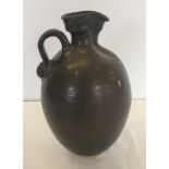 A studio pottery stoneware jug.