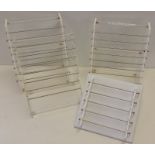 4 shop display jewellery bead stands. 3 plastic and 1 white, leather effect.