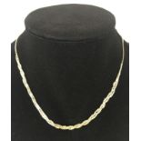 9ct gold 'S' chain necklace with 3 string cross over detail to front.