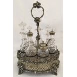 A silver plate and cut glass cruet set and stand.