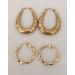 2 pairs of 9ct gold hooped earrings.