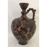 A late 19th / early 20th century decorative tortoise shell glaze large pottery ewer.