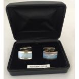 A pair of 925 silver cufflinks with pearlised blue panels.