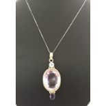 925 silver pendant set with a very large oval amethyst with moonstone and iolite.