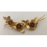 A 9ct gold brooch in the form of 3 roses.