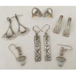 5 pairs of silver earrings.