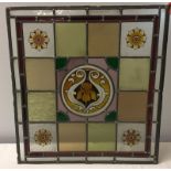 Modern stained glass window with Art Nouveau style Iris flower to centre.