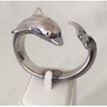 A 925 silver dolphin bangle.