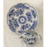 A 19th century Continental porcelain feeding cup with blue and white "Onion" pattern.