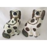 Two 19th century Staffordshire Spaniels figurines.