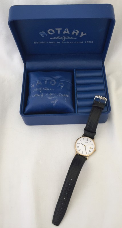 A boxed 9ct gold cased gents Rotary wristwatch with black leather strap.