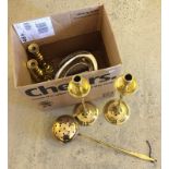 A box of brass and metalware to include 2 pairs of brass candlesticks.