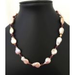 A boxed Pia freshwater pearl & ruby single strand necklace.