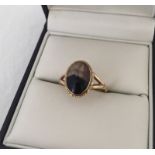 A 9ct gold dress ring set with oval shaped Blue John.