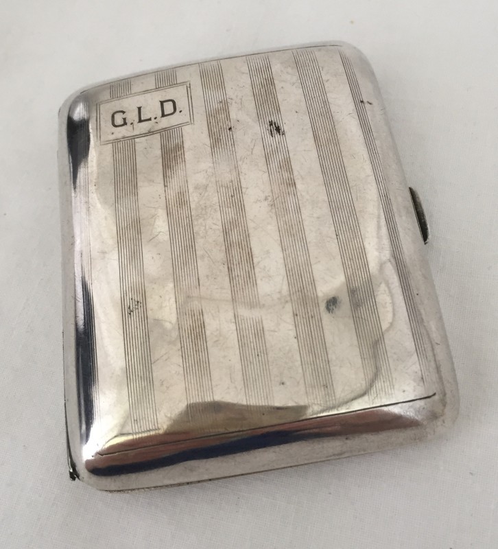 A silver cigarette case.