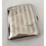 A silver cigarette case.